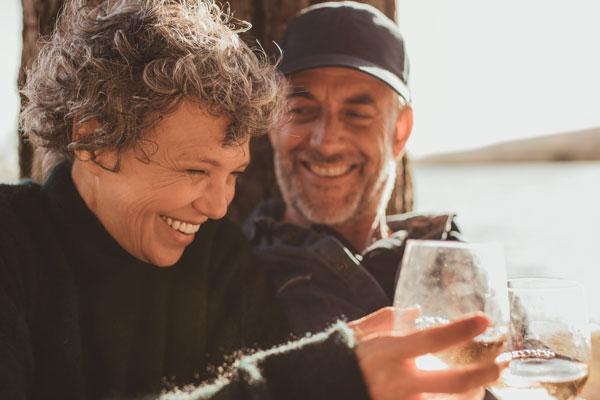 elder couple enjoying wine