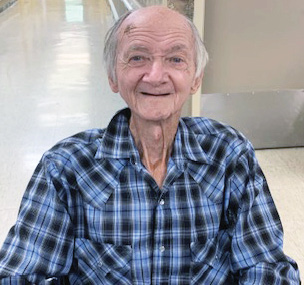 Franklin-Simpson Nursing and Rehab Resident Walter H. sitting and smiling for photo