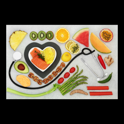 image of healthy foods laid out on a table along with a stethescope.