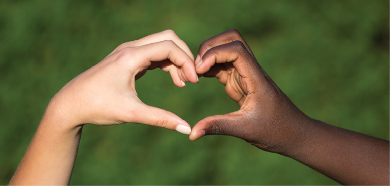 two hands coming together to make a heart shape