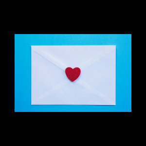 Love letter envelope on a blue background with a red felt heart sealing envelope